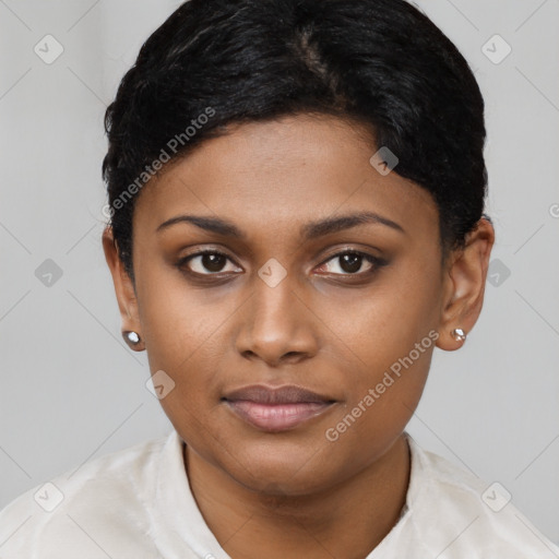 Joyful latino young-adult female with short  black hair and brown eyes