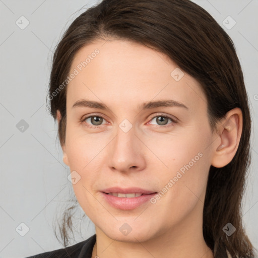 Joyful white young-adult female with medium  brown hair and grey eyes