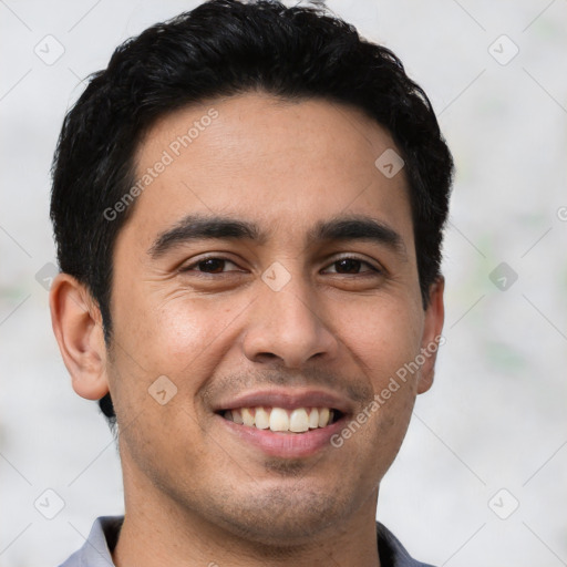 Joyful white young-adult male with short  black hair and brown eyes