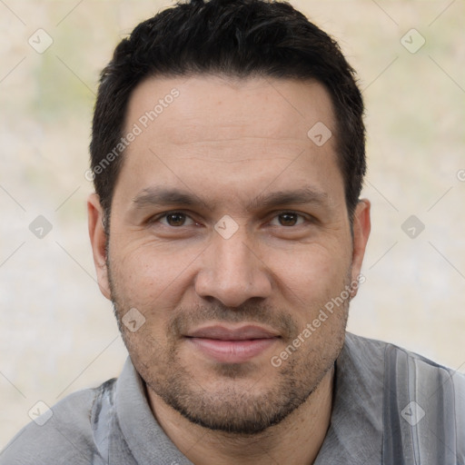 Joyful white adult male with short  black hair and brown eyes