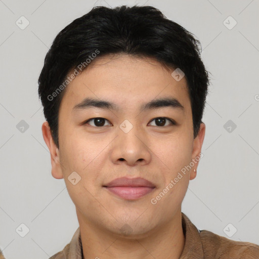 Joyful asian young-adult male with short  brown hair and brown eyes