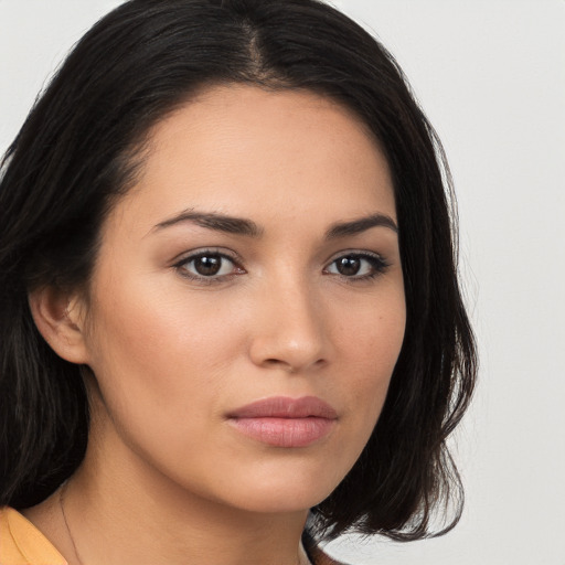 Neutral white young-adult female with long  brown hair and brown eyes