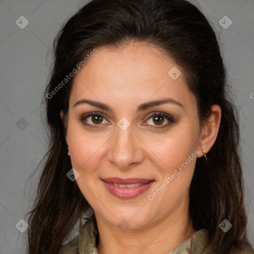 Joyful white adult female with long  brown hair and brown eyes