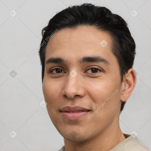 Joyful latino young-adult male with short  black hair and brown eyes