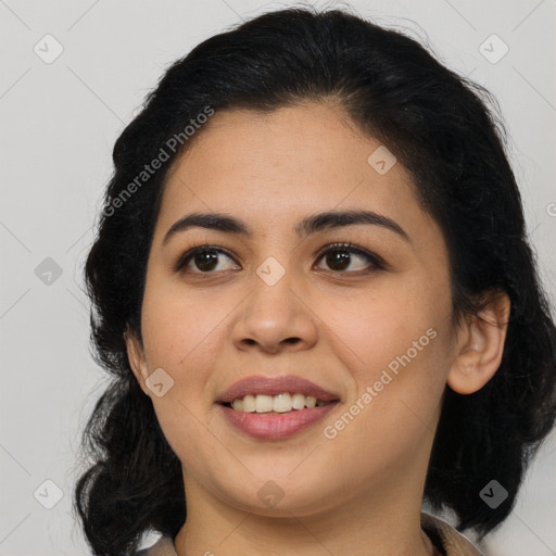 Joyful latino young-adult female with medium  brown hair and brown eyes