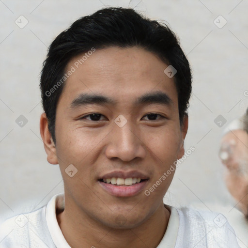 Joyful asian young-adult male with short  black hair and brown eyes