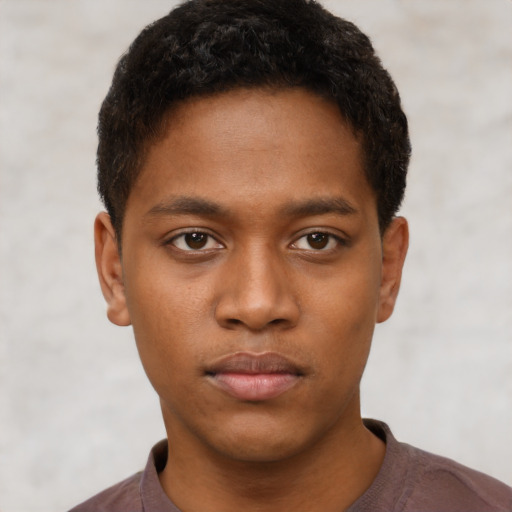 Neutral black young-adult male with short  brown hair and brown eyes