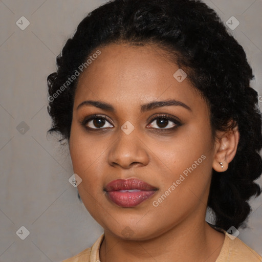 Joyful black young-adult female with long  black hair and brown eyes