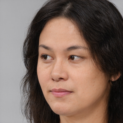 Neutral asian young-adult female with long  brown hair and brown eyes