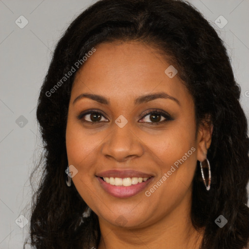 Joyful black young-adult female with long  brown hair and brown eyes