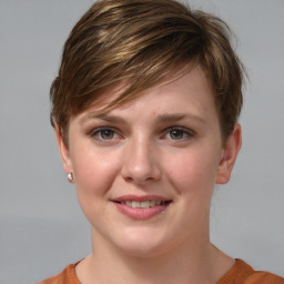 Joyful white young-adult female with short  brown hair and grey eyes