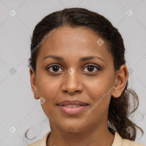 Joyful black young-adult female with medium  brown hair and brown eyes