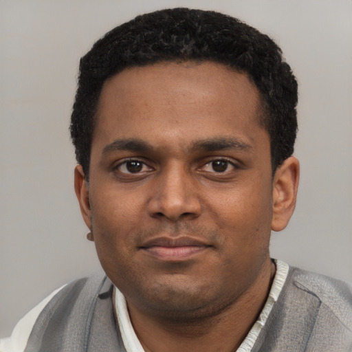 Neutral black young-adult male with short  black hair and brown eyes