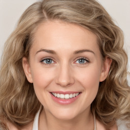 Joyful white young-adult female with medium  brown hair and blue eyes