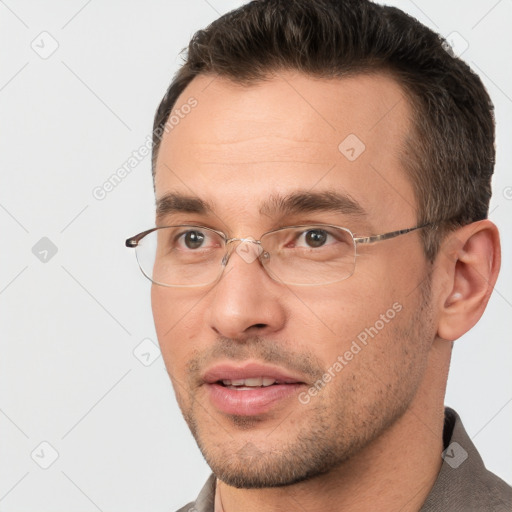 Joyful white adult male with short  brown hair and brown eyes