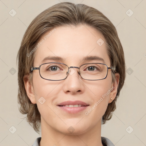 Joyful white adult female with medium  brown hair and grey eyes