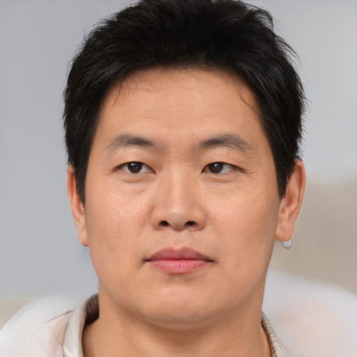 Neutral asian young-adult male with short  brown hair and brown eyes