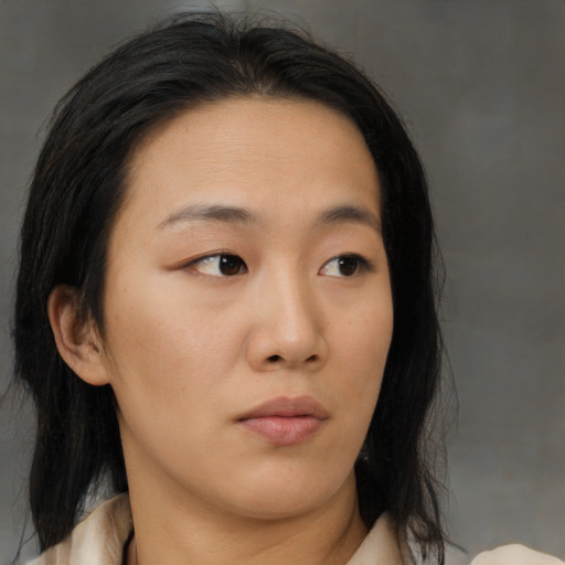 Neutral asian young-adult female with medium  brown hair and brown eyes