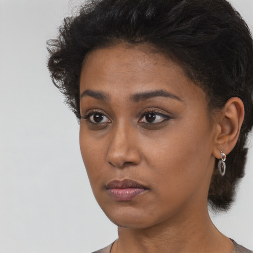 Neutral black young-adult female with short  brown hair and brown eyes