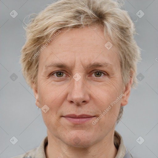 Joyful white adult female with short  brown hair and grey eyes