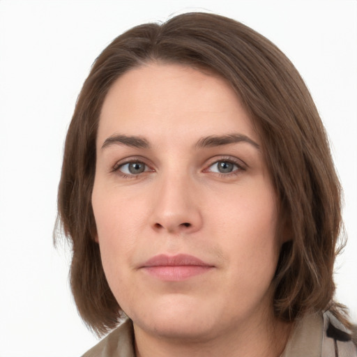 Neutral white young-adult female with medium  brown hair and green eyes