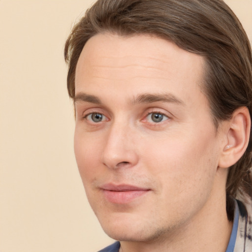 Joyful white young-adult male with medium  brown hair and brown eyes