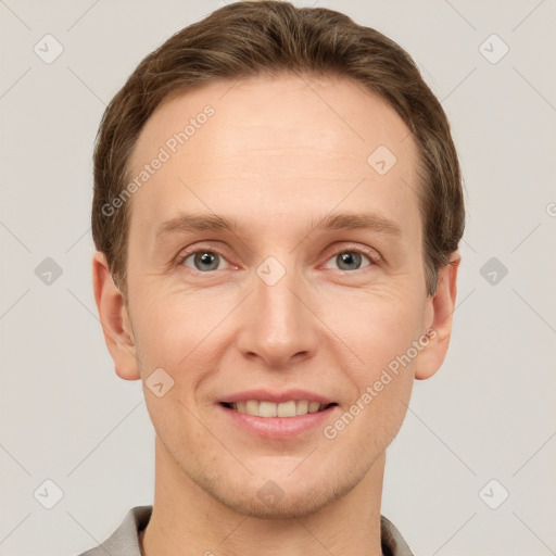 Joyful white adult male with short  brown hair and grey eyes