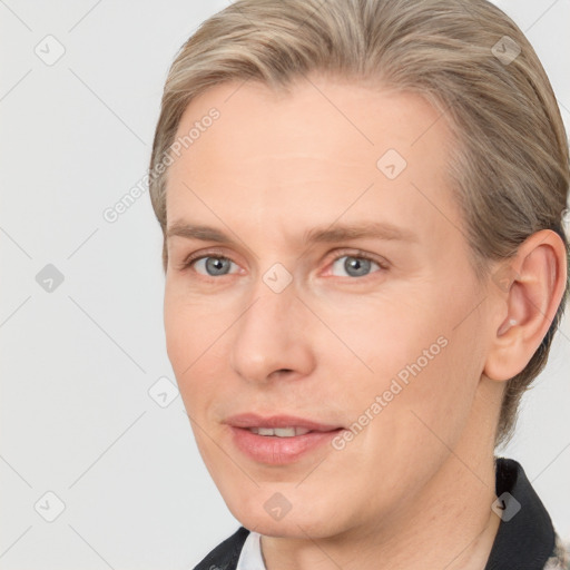 Joyful white adult female with medium  brown hair and grey eyes