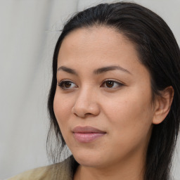 Joyful asian young-adult female with long  brown hair and brown eyes