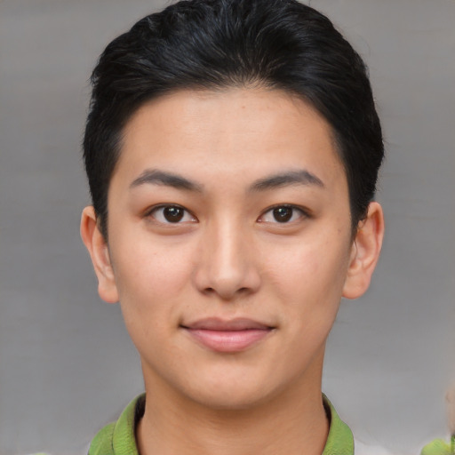 Joyful asian young-adult female with short  brown hair and brown eyes