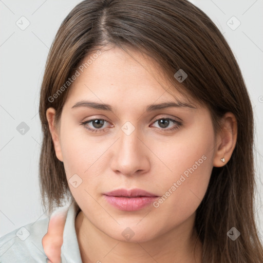 Neutral white young-adult female with long  brown hair and brown eyes