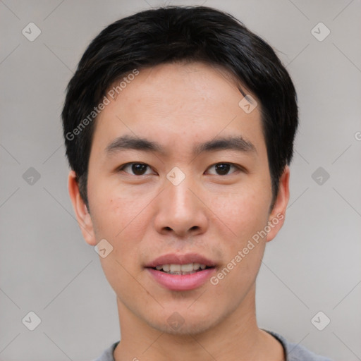 Joyful white young-adult male with short  black hair and brown eyes