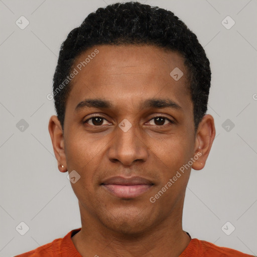 Joyful black young-adult male with short  black hair and brown eyes