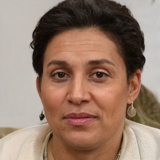 Joyful white adult female with short  brown hair and brown eyes