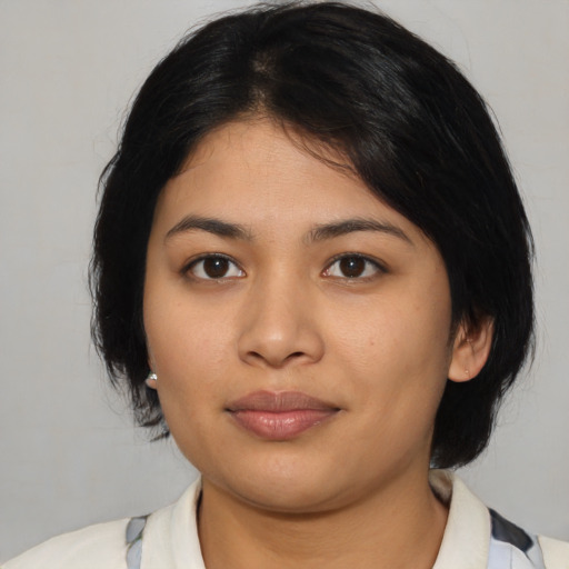 Joyful asian young-adult female with medium  black hair and brown eyes