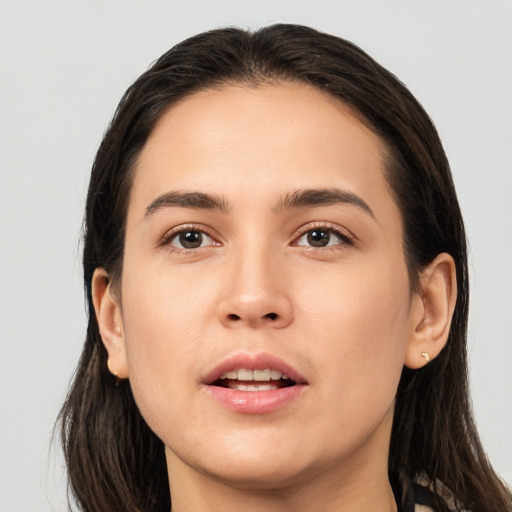 Joyful white young-adult female with long  brown hair and brown eyes