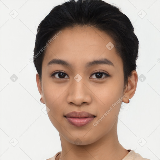 Joyful latino young-adult female with short  black hair and brown eyes