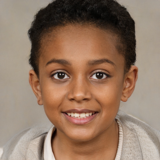 Joyful black child female with short  brown hair and brown eyes
