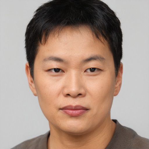 Neutral asian young-adult male with short  black hair and brown eyes