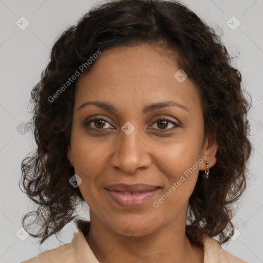 Joyful black adult female with medium  brown hair and brown eyes