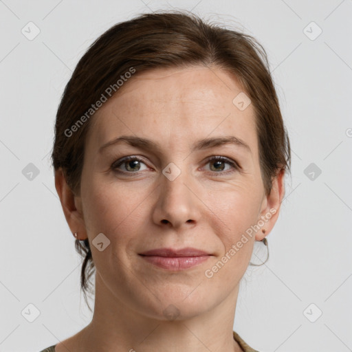 Joyful white adult female with medium  brown hair and grey eyes