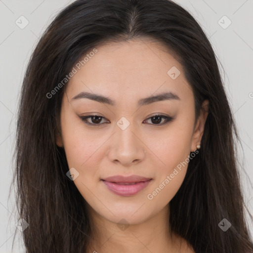 Joyful asian young-adult female with long  brown hair and brown eyes