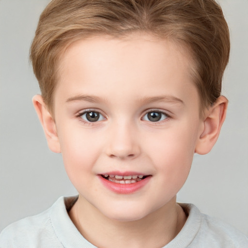 Joyful white child female with short  brown hair and brown eyes