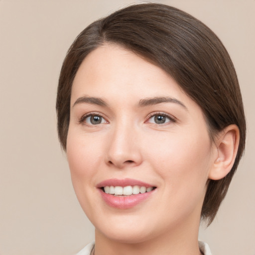 Joyful white young-adult female with medium  brown hair and brown eyes