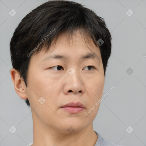 Neutral asian young-adult male with short  brown hair and brown eyes