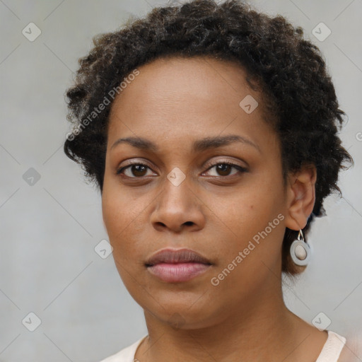 Neutral black young-adult female with short  brown hair and brown eyes