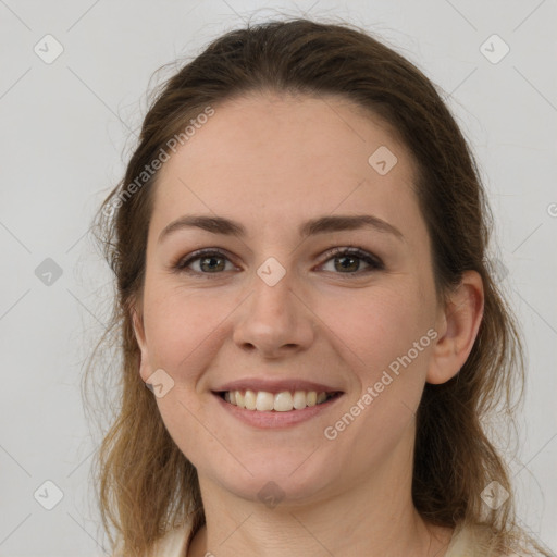 Joyful white young-adult female with medium  brown hair and grey eyes