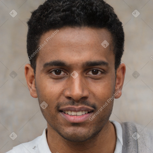 Joyful black young-adult male with short  black hair and brown eyes