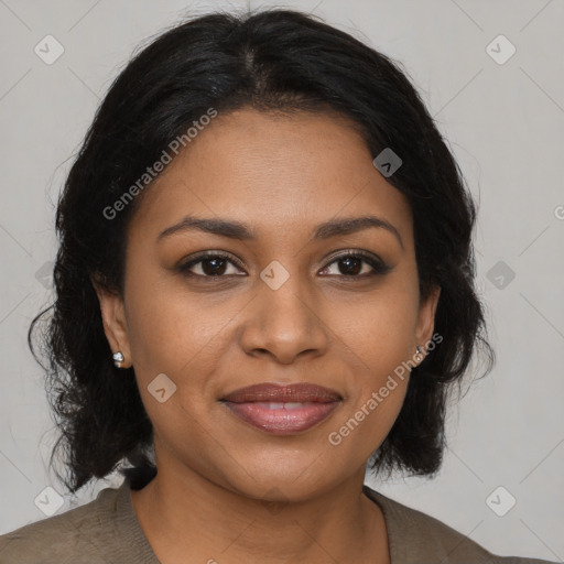 Joyful black young-adult female with medium  brown hair and brown eyes