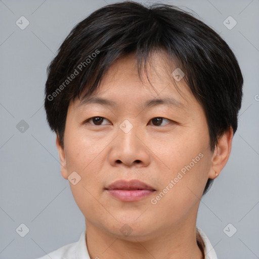 Joyful asian adult female with short  brown hair and brown eyes